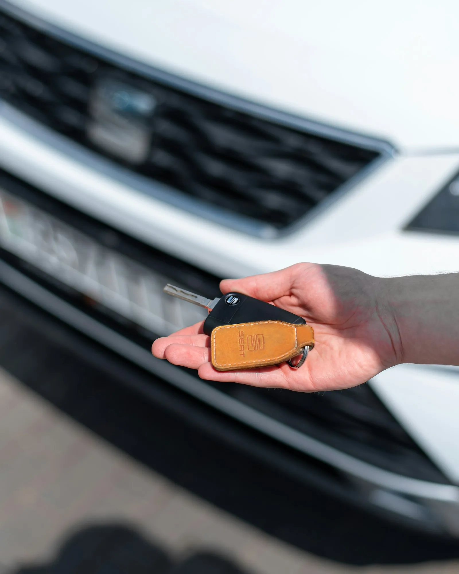 A customer receiving the keys to a new car